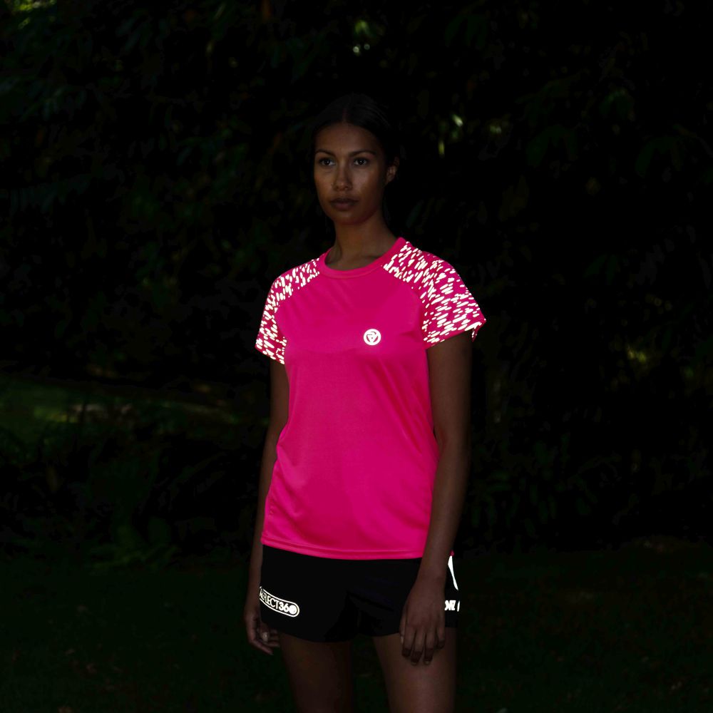 listing-lifestyle Women's Reflective Short Sleeve Training Top pink lights on in garden at night