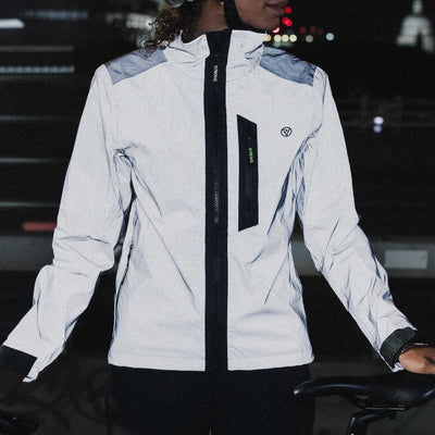 lifestyle APEX Women’s 100% Reflective Waterproof Cycling Jacket front in city
