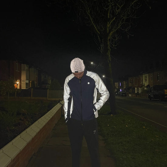 listing-lifestyle Solaris Men’s Reflective Waterproof Active Jacket navy doing a run at night