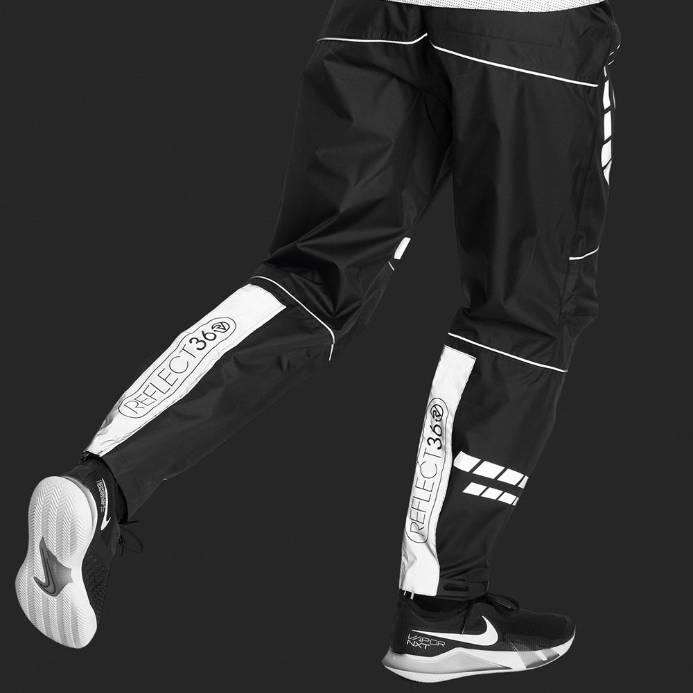 lifestyle showing reflective back panels Men's Waterproof Reflective Trousers
