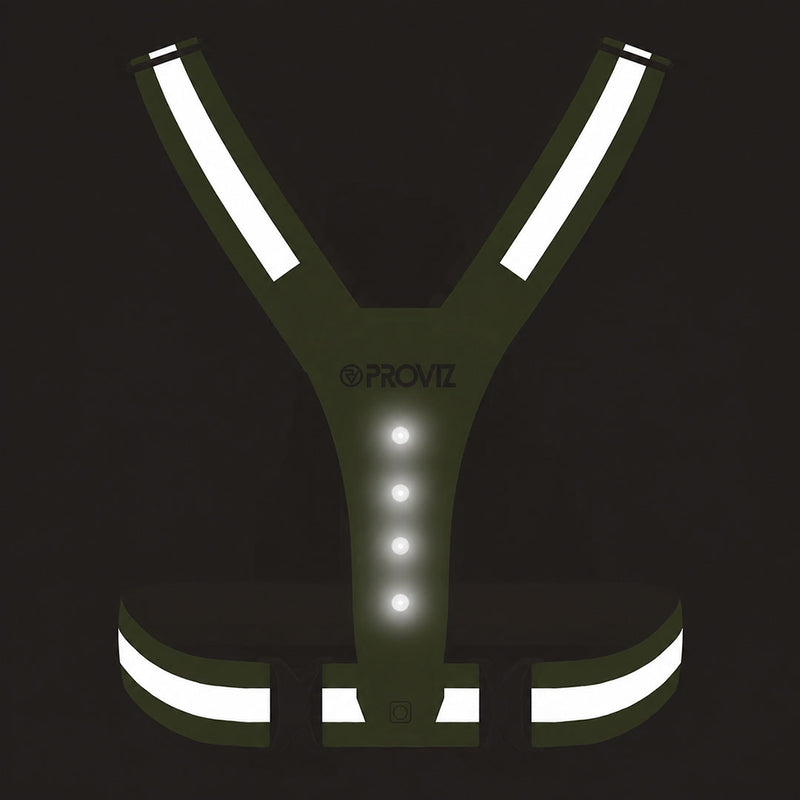 lifestyle A yellow PROVZ reflective safety vest with integrated LED lights, featuring reflective strips on the shoulders and waist, shown on a solid black background.